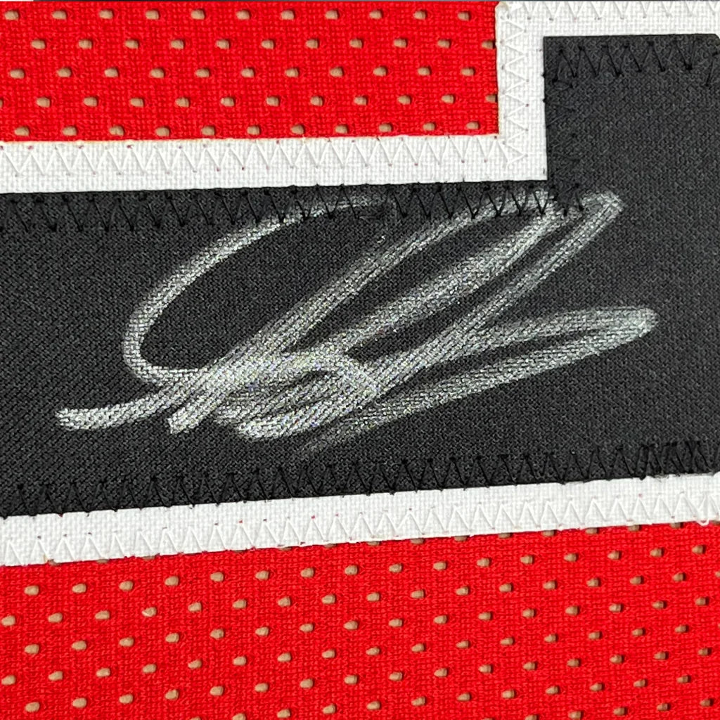 Autographed Black and Red Dennis Rodman Bulls Jersey in a stylish frame for collection pop