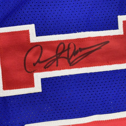 Framed autographed dennis rodman detroit blue basketball jersey with red mesh stripe and white trim signed in black ink