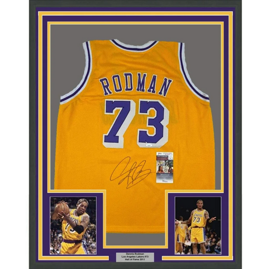 Back side of a framed autographed yellow los angeles lakers basketball jersey with purple and white trim featuring rodman 73