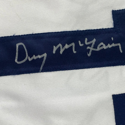 Framed autographed Denny McLain Detroit Tigers jersey with navy satin ribbon and silver signature, JSA COA