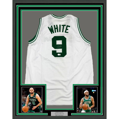 Back side of a framed autographed white boston celtics basketball jersey with green lettering featuring white number 9