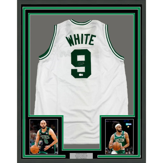 Back side of a framed autographed white boston celtics basketball jersey with green lettering featuring white number 9
