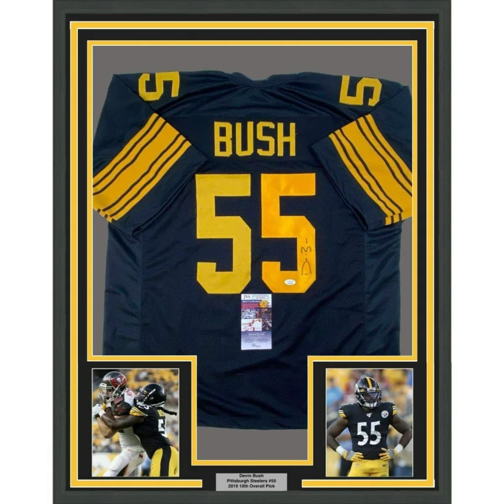 Framed autographed Devin Bush black and yellow Pittsburgh Steelers color rush football jersey with number 55 and gold trim