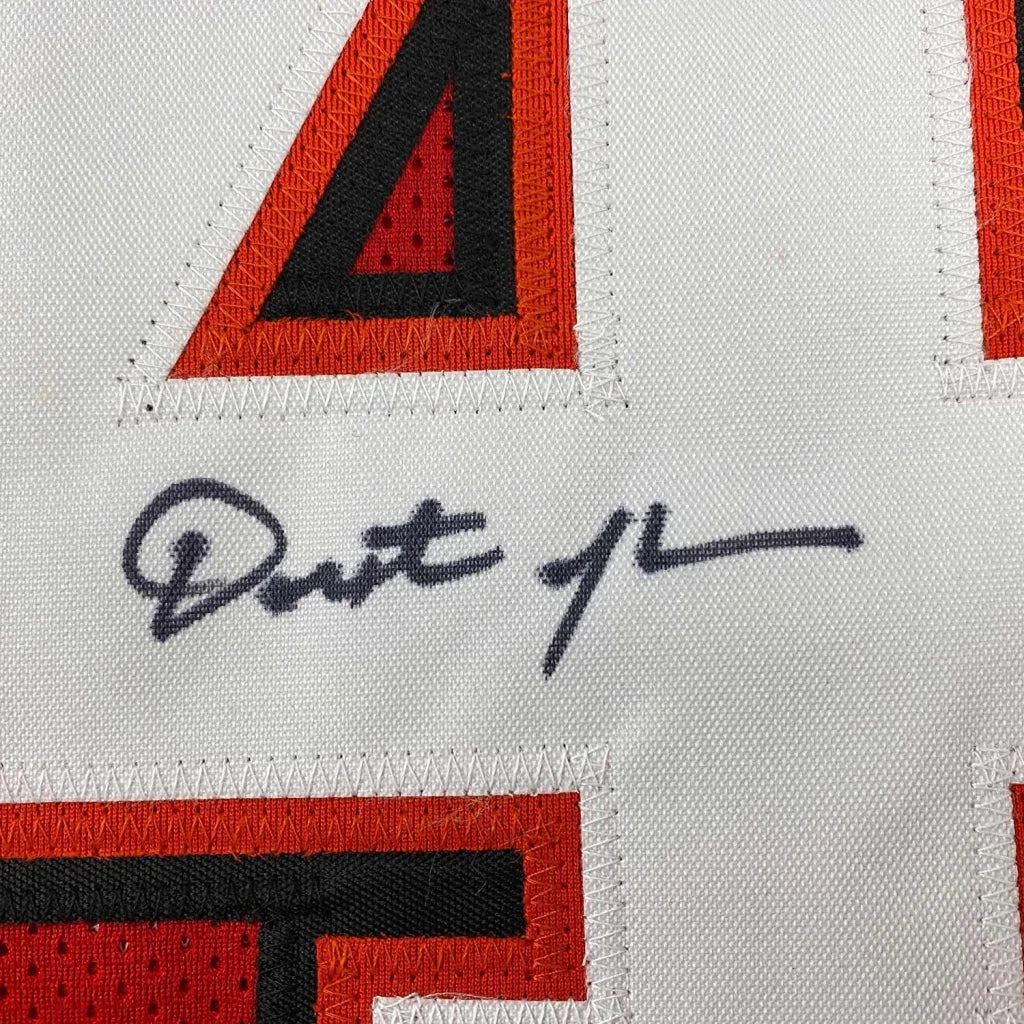 White mesh football jersey with red and black embroidered lettering and a dark gray signature on the front