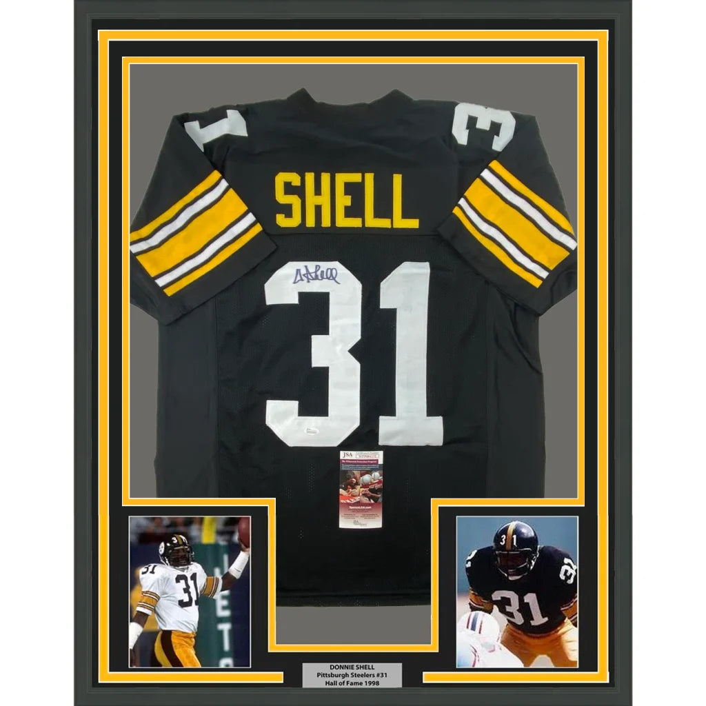 Back of framed autographed Donnie Shell Pittsburgh Steelers black jersey number 31 Shell JSA COA