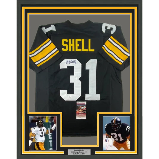 Back of framed autographed Donnie Shell Pittsburgh Steelers black jersey number 31 Shell JSA COA