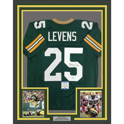 Back side of a framed green and gold green bay packers jersey with white number 25 and name Levens signed by Dorsey