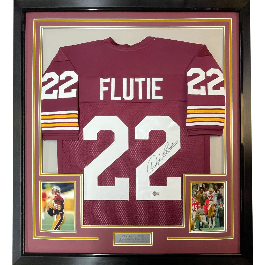 Framed signed Doug Flutie #22 maroon football jersey with two photos for fans