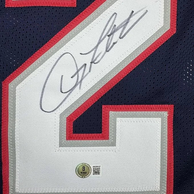Framed Autographed Doug Flutie 35x39 New England Blue Football Jersey Beckett BAS COA | Certified Authentic Signed Memorabilia | vintageantiquesgifts.com