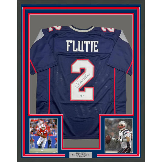 Framed Autographed Doug Flutie 35x39 New England Blue Football Jersey Beckett BAS COA | Hall of Fame Sports Memorabilia | vintageantiquesgifts.com
