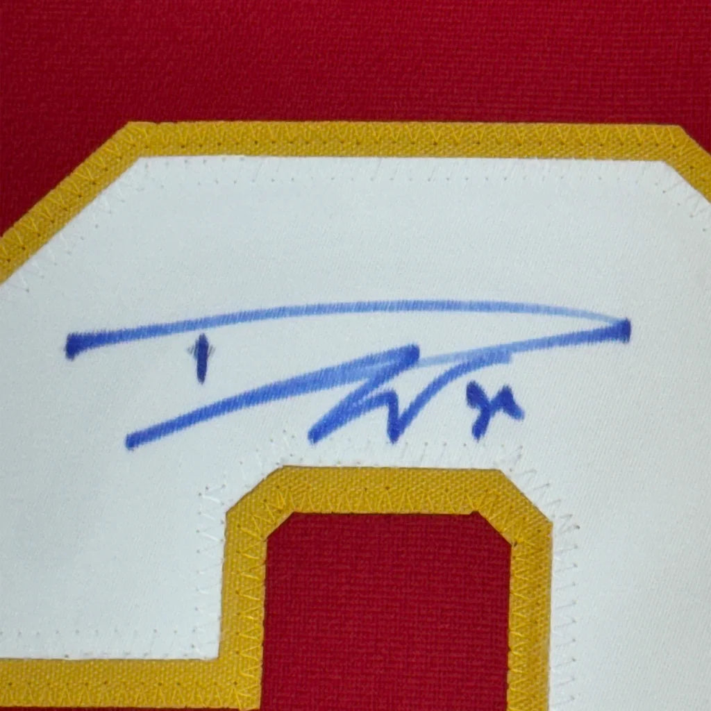 Framed autographed Dustin Wolf Calgary Flames red jersey with blue ink signature on embroidered patch