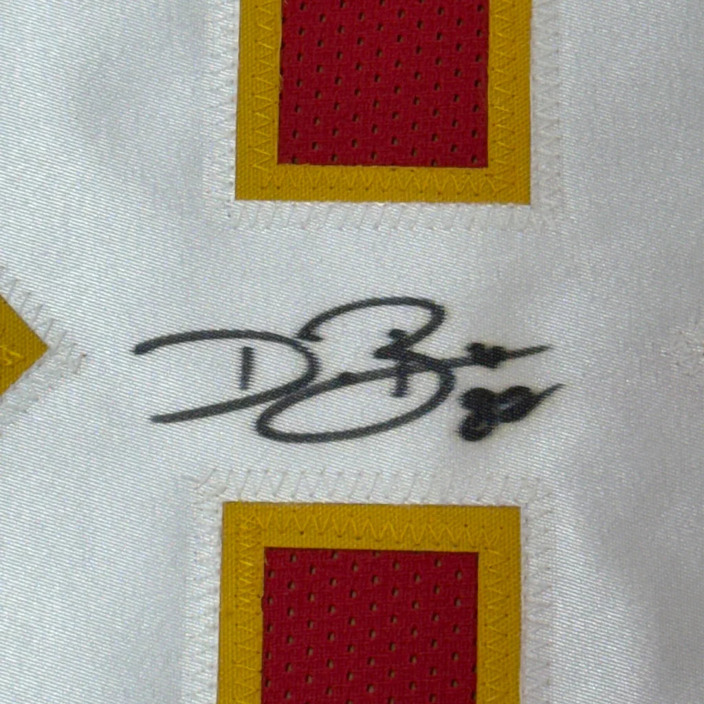 Black ink signature on a white Kansas City red football jersey with red and yellow square patches framed with JSA COA
