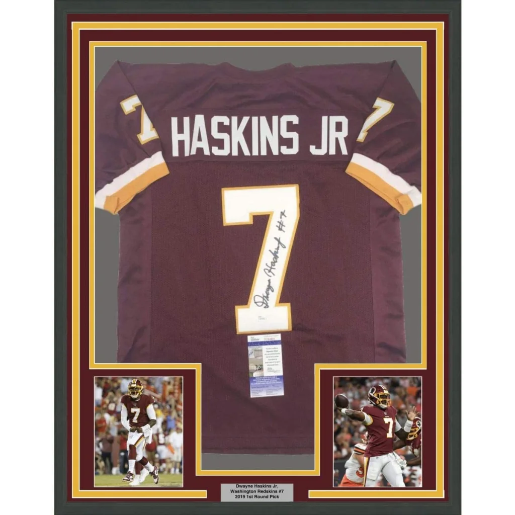 Framed autographed Dwayne Haskins Jr Washington Redskins jersey with player photos and authentication