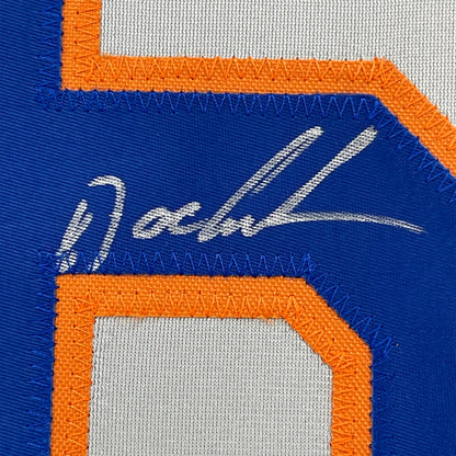 Autographed blue and orange Dwight Gooden Mets jersey framed with photos