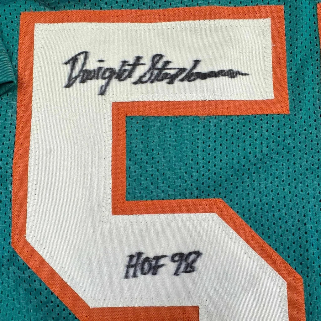 Framed autographed Dwight Stephenson HOF 98 teal jersey with signed No. 5 patch