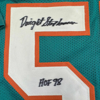 Framed autographed Dwight Stephenson HOF 98 teal jersey with signed No. 5 patch