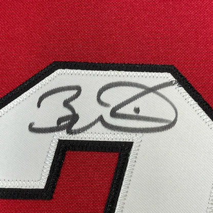 Red Miami Heat jersey with Dwyane Wade autograph and black white patch for display