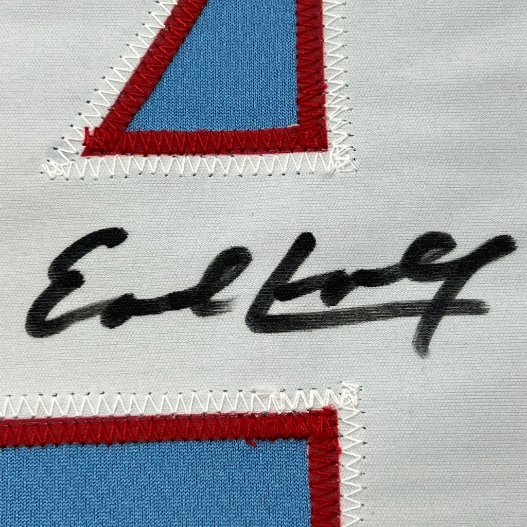 Autographed light blue and red fabric patch on white jersey from Campbell Collection
