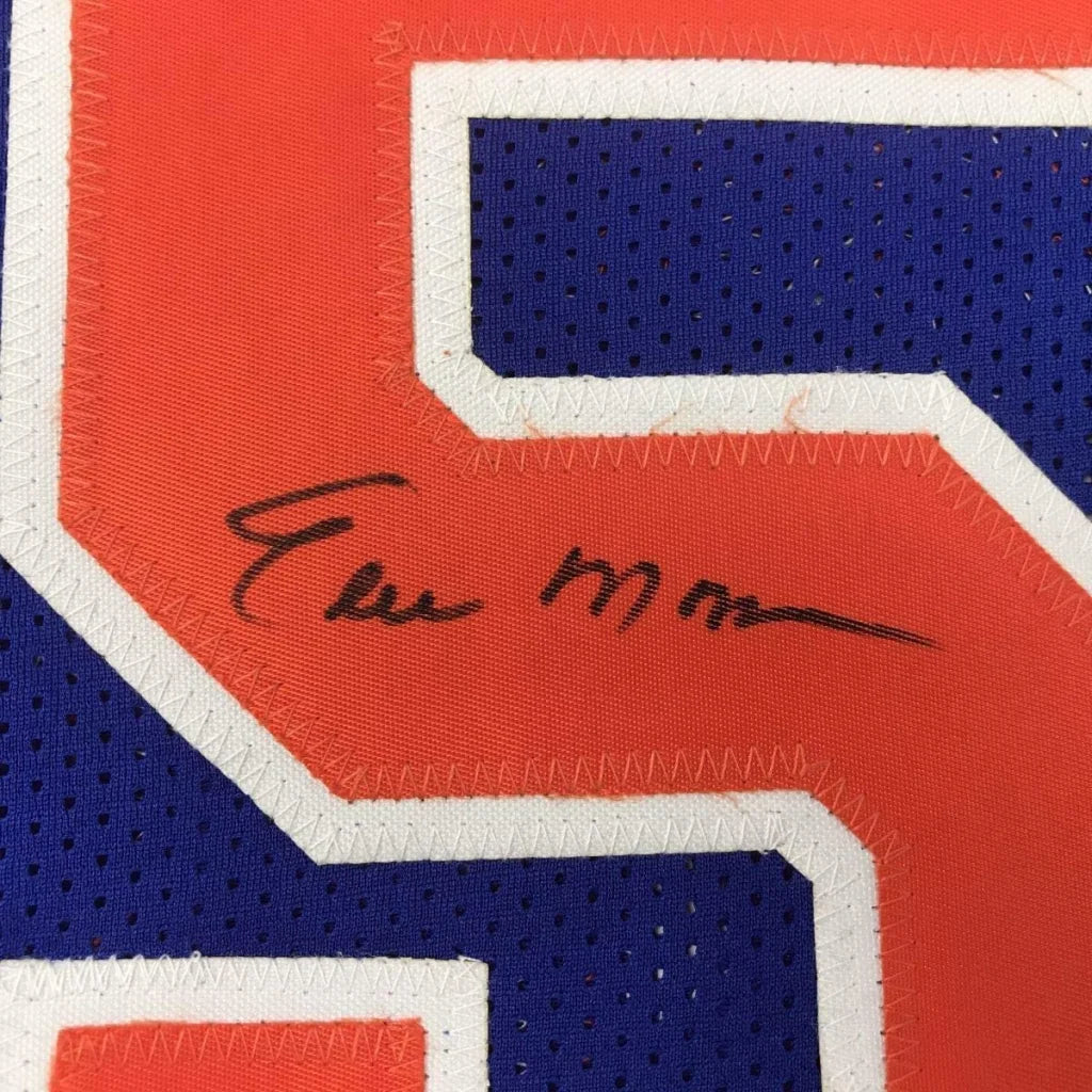 Framed autographed Earl Monroe New York blue basketball jersey with black signature