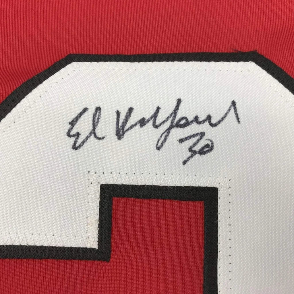 Framed autographed Ed Belfour Chicago Blackhawks jersey with Elway 32 signature patch