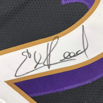 Framed autographed black Ed Reed Baltimore Ravens jersey with gold trim, JSA COA