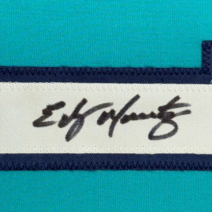 Teal athletic fabric with white and navy trim on Edgar Martinez signed jersey display