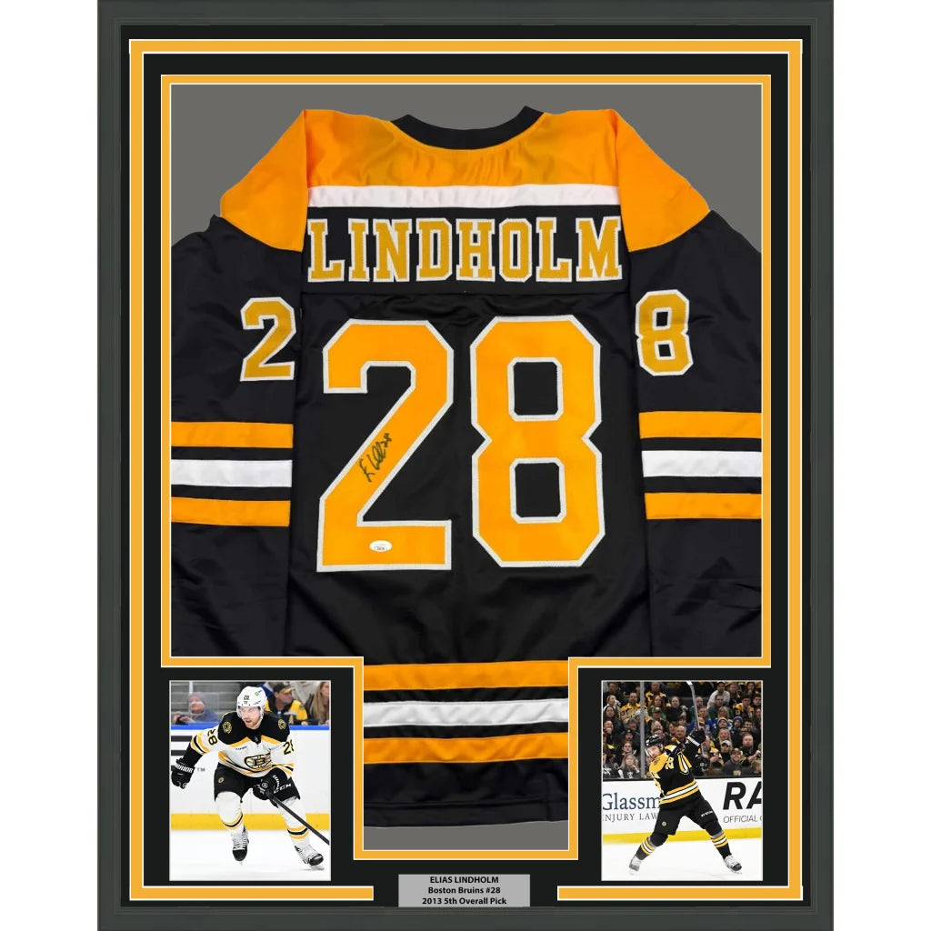 Framed Boston Bruins jersey with autograph and player photos ready to hang