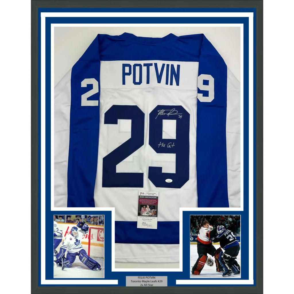 Professionally framed Toronto white hockey jersey with Felix Potvin autograph for your man cave