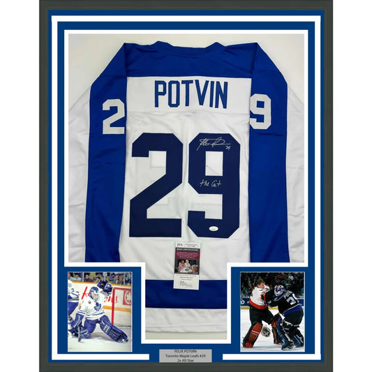 Professionally framed Toronto white hockey jersey with Felix Potvin autograph for your man cave