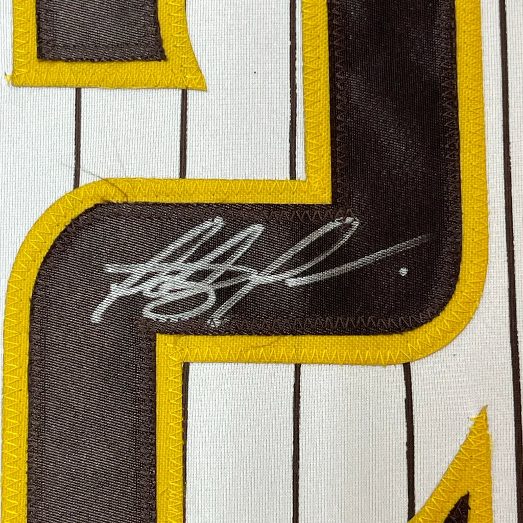 Autographed Fernando Tatis San Diego Pinstripe Jersey with JSA COA showing signature and jersey number