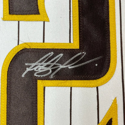 Autographed Fernando Tatis San Diego Pinstripe Jersey with JSA COA showing signature and jersey number