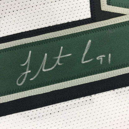 Autographed Fletcher Cox white and green sports jersey professionally framed for your man cave