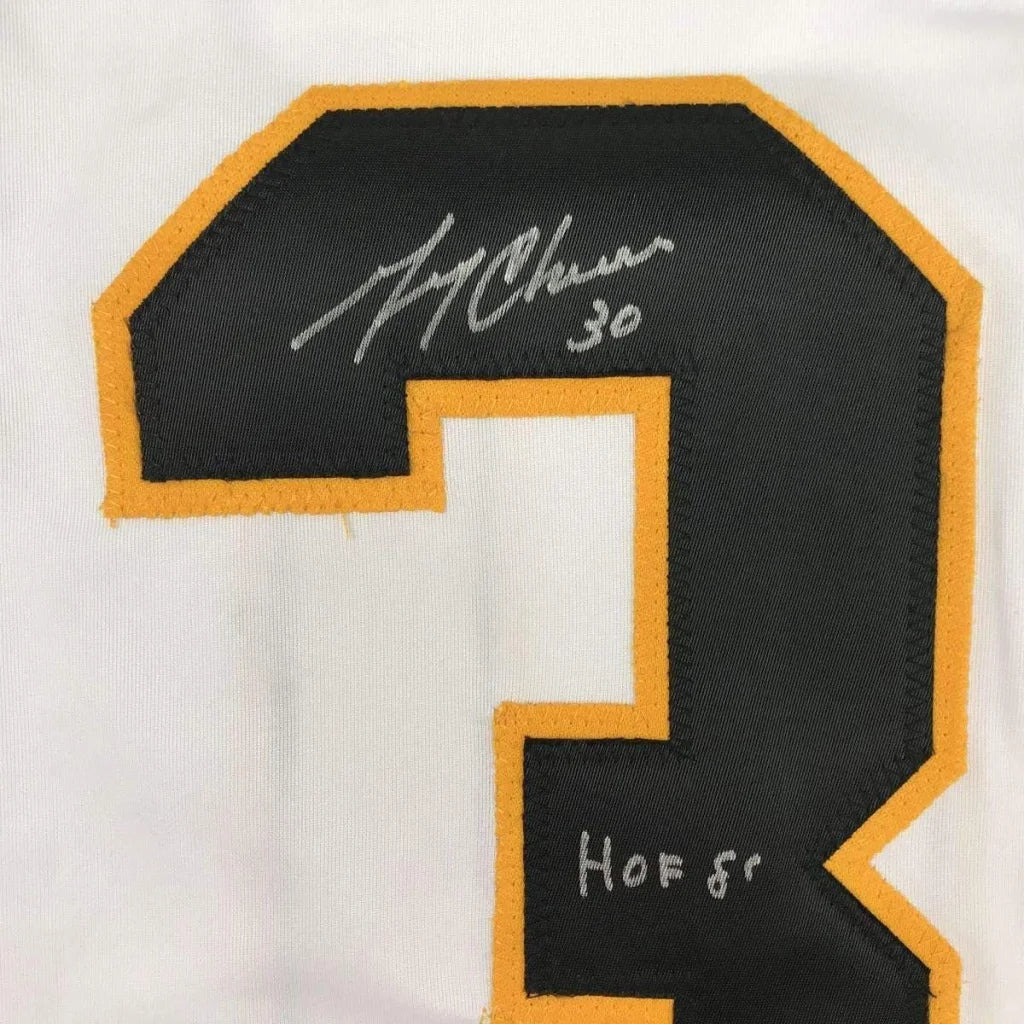 Black and gold embroidered 30 patch with signature and HOF 87 on Gerry Cheevers framed jersey
