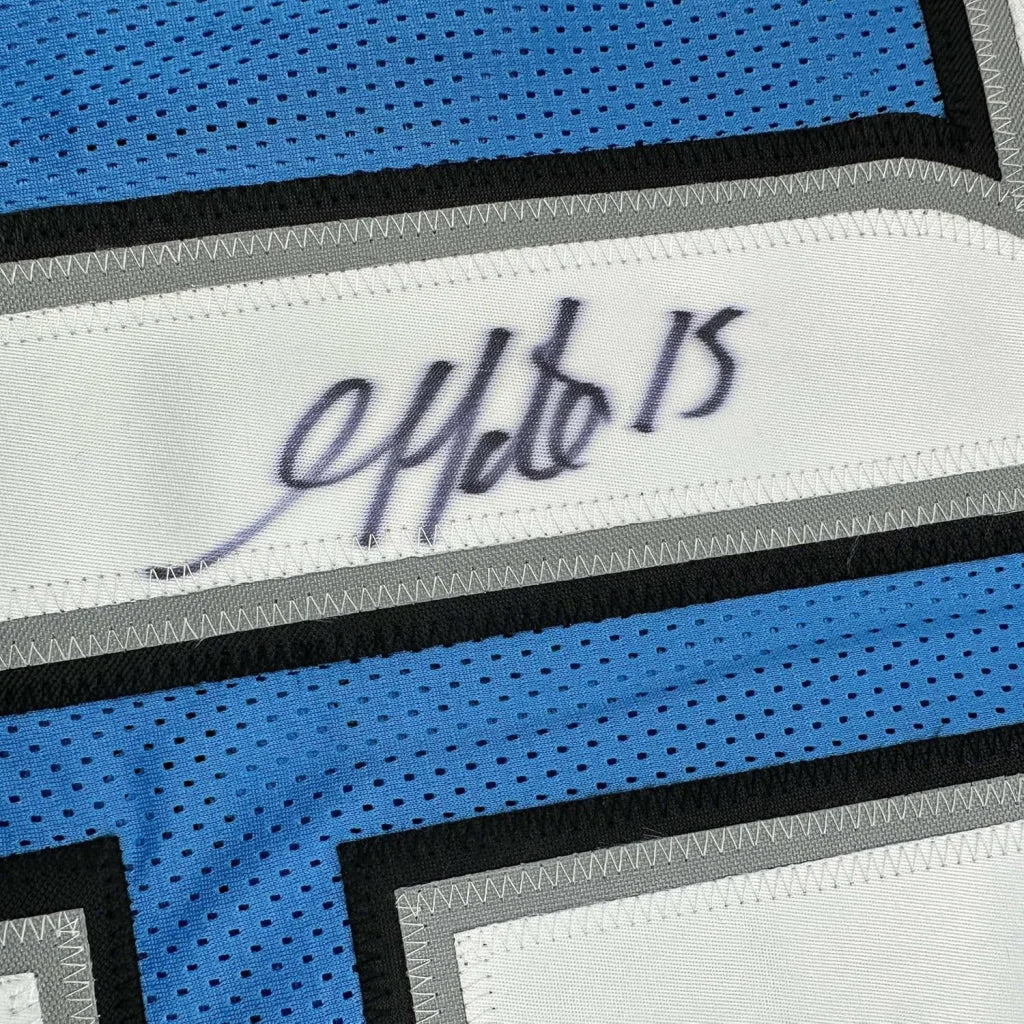 Framed autographed blue and white mesh detroit football jersey with black gray trim and signature on white panel