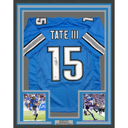 Back of a framed autographed blue detroit lions football jersey with white and silver trim featuring tate iii 15 and beckett coa
