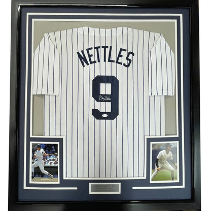 Framed signed New York Yankees pinstripe jersey with autograph and photos for fans