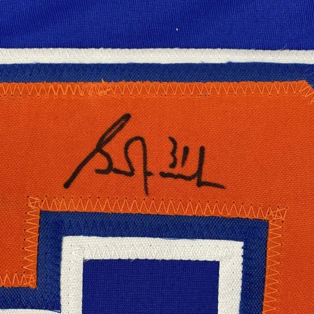 Framed autographed Grant Fuhr orange and blue Edmonton Oilers jersey