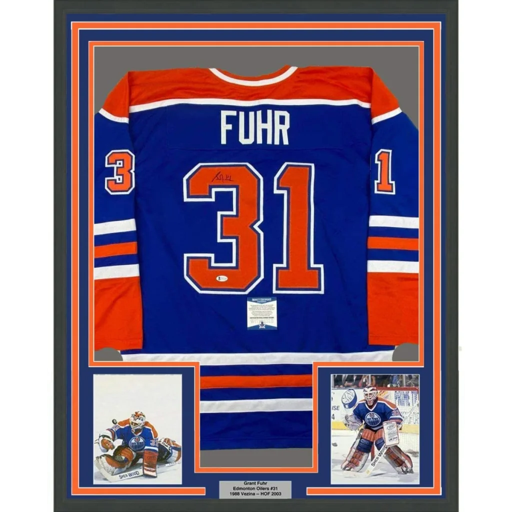 Framed autographed Grant Fuhr Edmonton Oilers blue jersey with number 31