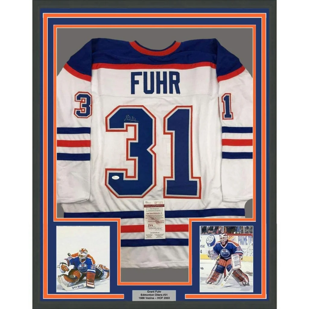 Framed Autographed Grant Fuhr 35x39 Edmonton White Hockey Jersey JSA COA | Hall of Fame Sports Memorabilia | vintageantiquesgifts.com