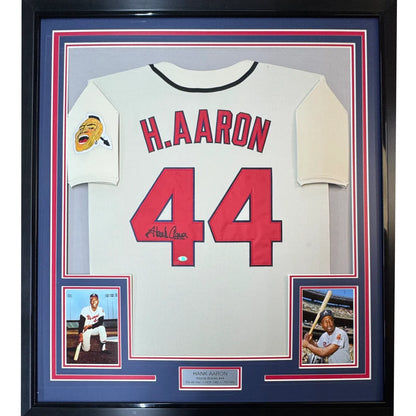Framed autographed Hank Aaron Atlanta Braves jersey with h. in red, Steiner COA