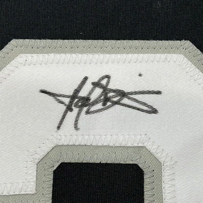 Framed autographed Harold Baines Chicago Blackhawks jersey with embroidered number patch