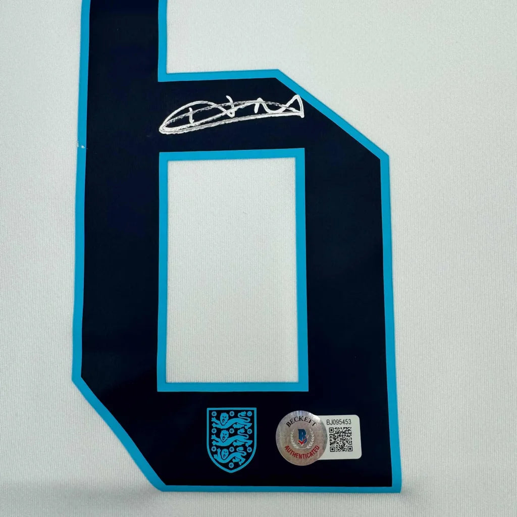 Framed Autographed Harry Maguire 35x39 England White Soccer Jersey Beckett BAS COA | Certified Authentic Signed Memorabilia | vintageantiquesgifts.com