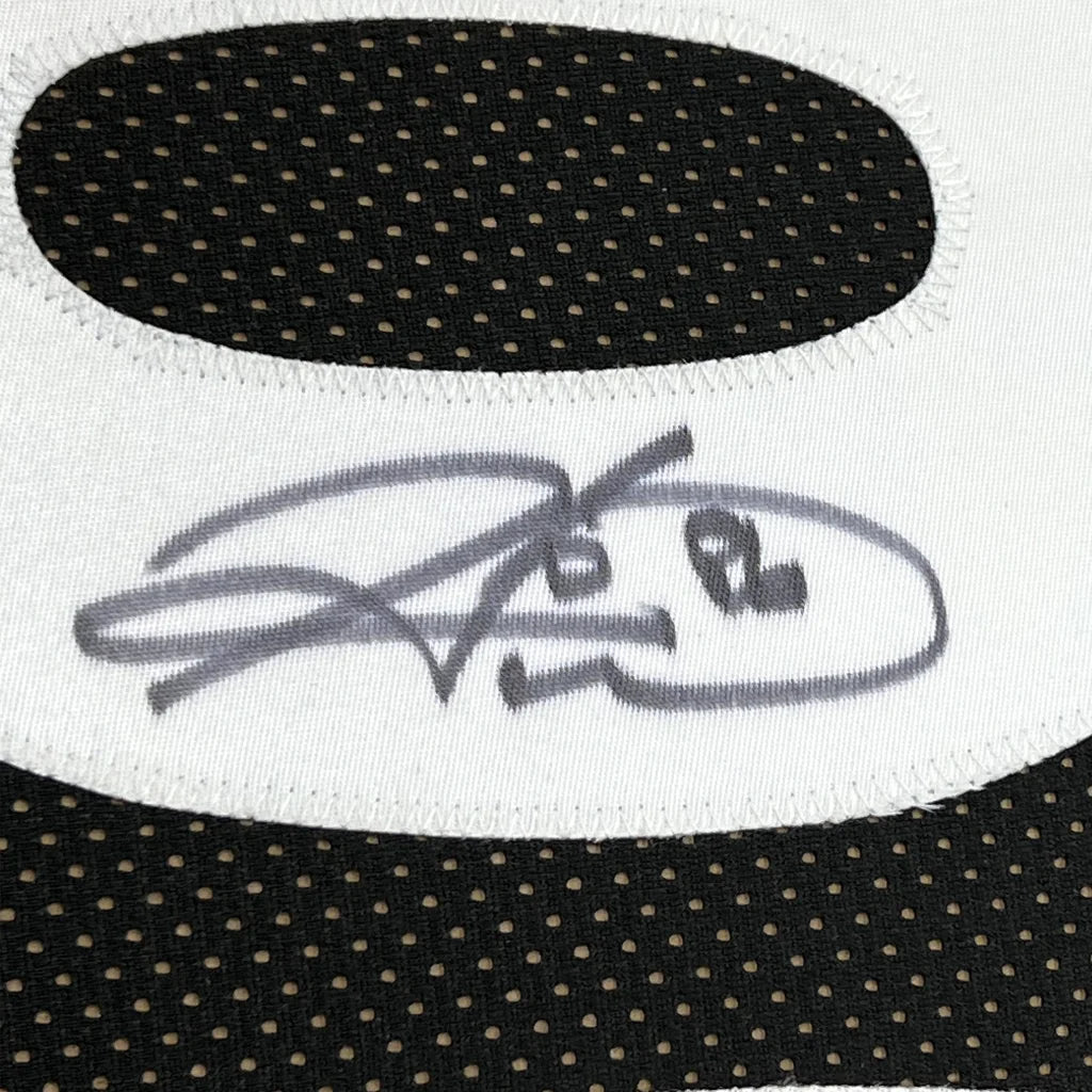 Black and white athletic wear with autograph from Jerome Bettis Steelers jersey display