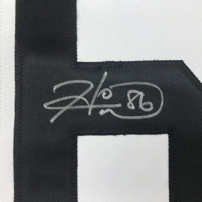 Black embroidered Hines Ward 86 signature patch on framed Pittsburgh jersey