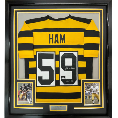 Back of a yellow and black striped framed autographed jack ham hall of fame 88 football jersey with number 59