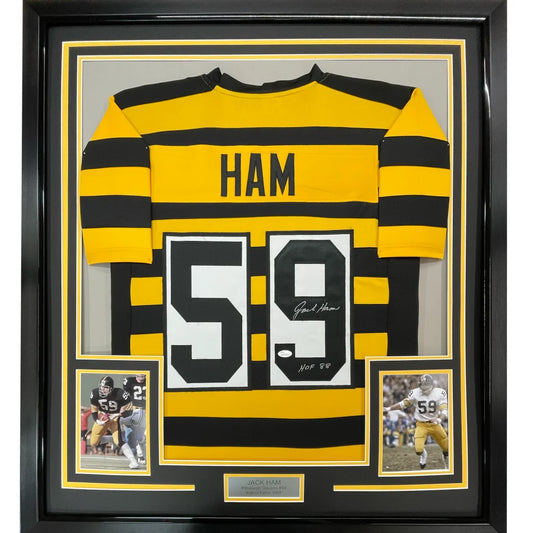 Back of a yellow and black striped framed autographed jack ham hall of fame 88 football jersey with number 59