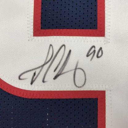 Autographed white and blue Clowney 90 jersey with red trim and action photos ready to ship