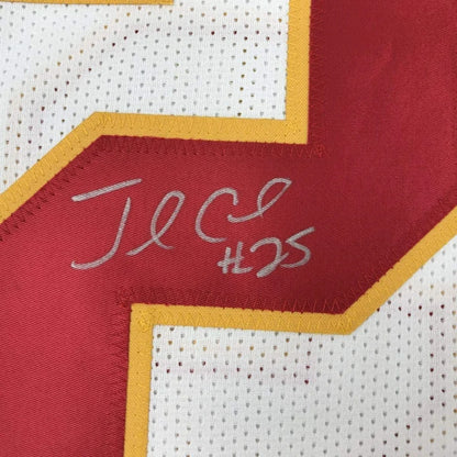 Framed autographed red and white mesh football jersey with yellow trim signed by jamaal charles in silver thread