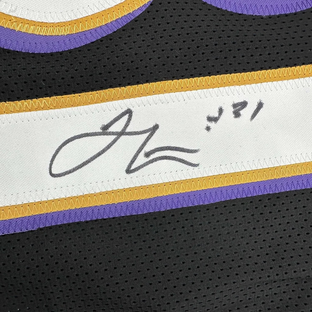 Black Ray Lewis Ravens jersey with purple gold trim, autograph, photos, and plaque