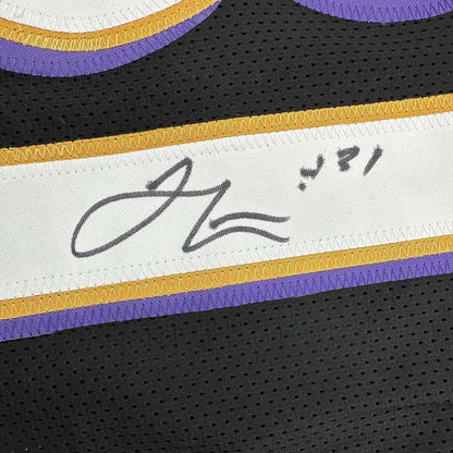 Black Ray Lewis Ravens jersey with purple gold trim, autograph, photos, and plaque